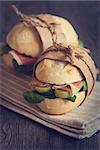 Fresh sandwiches with ham and vegetables. Rustic style.
