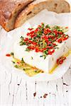 Marinated cheese with olive oil, thyme, chili and lemon zest.