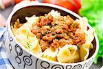 Delicious bow tie pasta Bolognese in a bowl