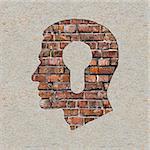 Profile of Head with a Keyhole Icon on the Brick and Plastered Wall.