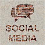 Social Media Concept with Speech Bubble Icon on the Brick and Plastered Wall.