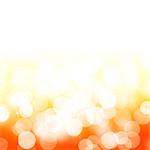 Abstract blurred bokeh orange background with copy space