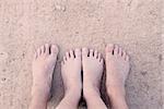 barefoot in sand and water on beach  in summer holidays relaxing