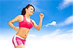 asian smiling runner woman jogging in sunny day