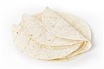 wheat round tortillas, folded on white background