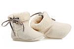 Pair of baby booties over white