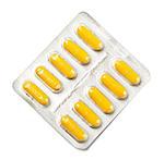package of yellow capsules isolated on white