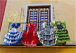 Traditional flamenco dresses at a house in Malaga, Andalusia, Spain.