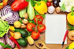 Fresh Vegetables Composition on the Wooden Background and Notebook for Recipes or Menu