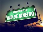 Welcome to Rio De Janeiro - Green Billboard on the Rising Sun Background.