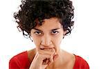 hispanic frustrated woman biting fingers, angry, looking at camera