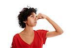 hispanic woman holding breath closing nose with fingers on white background