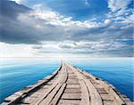 Bridge in the ocean against the sky