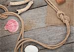 Ship rope with burlap on old wooden texture background with copy space