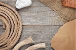 Ship rope with burlap on old wooden texture background with copy space