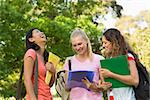 Group of happy female college friends at the campus