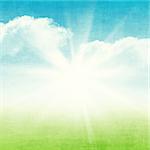 Grunge abstract summer background with blue sky and green field