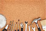 Set of tools on cork panel background with copy space