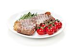 Sirloin steak with rosemary and cherry tomatoes on a plate. Isolated on white background