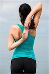 Beautiful young woman doing outdoor morning exercises