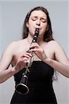Portrait of Young Female Musician Playing Clarinet