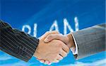 Composite image of business handshake against plan written in white in sky