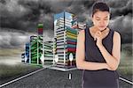 Thinking businesswoman against cityscape on stormy landscape background