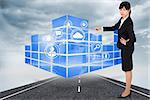 Businesswoman pointing against cloudy landscape background with street