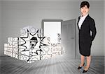 Smiling businesswoman against open door on white wall