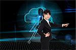 Smiling businesswoman pointing against keyhole on technological background