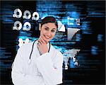 Smiling female doctor in thinkers pose against blue blurred texts