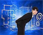 Smiling businesswoman bending against abstract blue squares