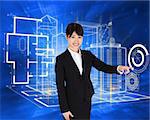 Smiling businesswoman pointing against abstract blue squares