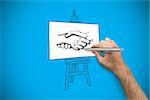 Hand holding a silver pen against blue background with vignette