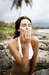 Young woman blowing a kiss at Las Galeras, Samana Peninsula, Dominican Republic.