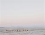Row of traffic cones on the flat desert surface of  Black Rock, Nevada.