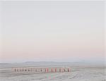 Row of traffic cones on the flat desert surface of  Black Rock, Nevada.