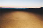 Illuminated desert landscape, dusk