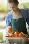 Organic Vegetable on Display with Farmer; Organic Yellow and Red Bell Peppers