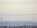 Oil rigs and power lines in the Midway-Sunset oil fields, the largest in California