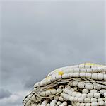 Pile of commercial fishing nets, with white floats, on the quayside at Fisherman's Terminal, Seattle.