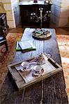 Tea tray with teapot and floral china cups in hotel, Hostellerie Les Griffons, Bourdeilles, North Dordogne, France