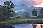 Atmospheric autumn sunset from the River Brathay near Elterwater, Lake District, Cumbria, England, United Kingdom, Europe