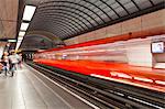 A train pulls out of a station on the Lyon metro system, Lyon, Rhone, Rhone-Alpes, France, Europe