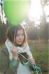 Young Woman with Balloons Outdoors, Mannheim, Baden-Wurttemberg, Germany