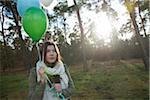 Young Woman with Balloons Outdoors, Mannheim, Baden-Wurttemberg, Germany