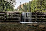 creek and man made waterfall in the forest