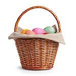 wicker basket full of pastel colors easter eggs, white background