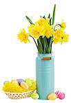 bouquet of daffodils flowers in blue vase with easter eggs   isolated on white background