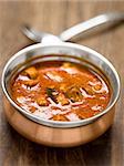 close up of a bowl of spicy indian mutton curry